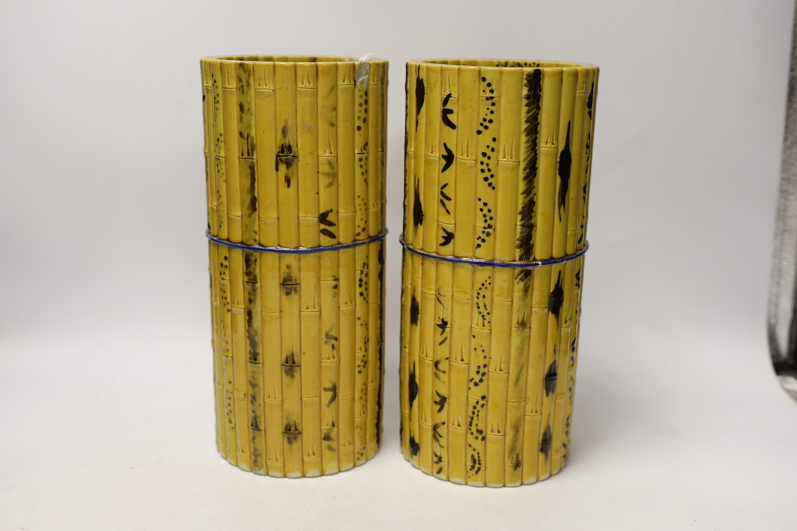 A pair of Chinese polychrome glazed faux bamboo vases, 19th century, 27cm high